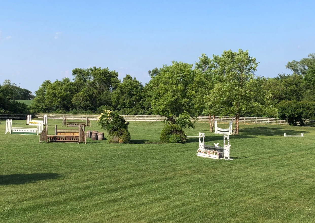 Jumping obstacles in the field at Twenty One farms stables.